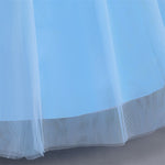 hemline detail of layered sky-blue mesh skirt